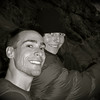 SmugMug > all-time keyword > kalymnos > Sheltering from a massive rainstorm in the Grande Grotta after finishing Ivi (7b or 25). Overhangs are nature's multipurpose architectural features.